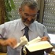MK Ben-Ari tearing the New Testament before the camera